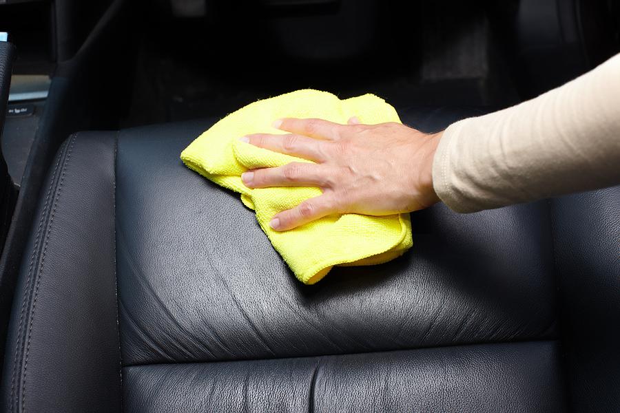 bigstock-Hand-cleaning-car-seat-49817048_2048x